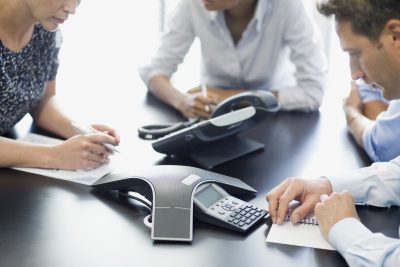 Business people talking on conference call