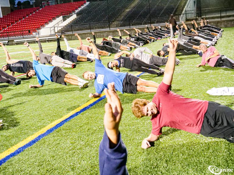 Employees doing exercises in a bootcamp