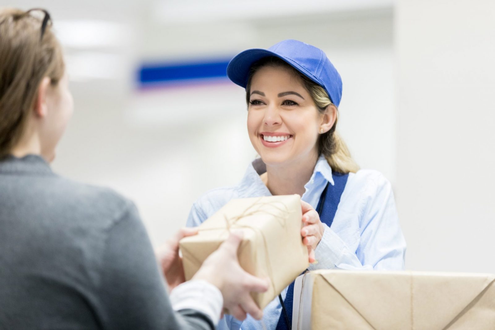 Woman drops off a package at the post office