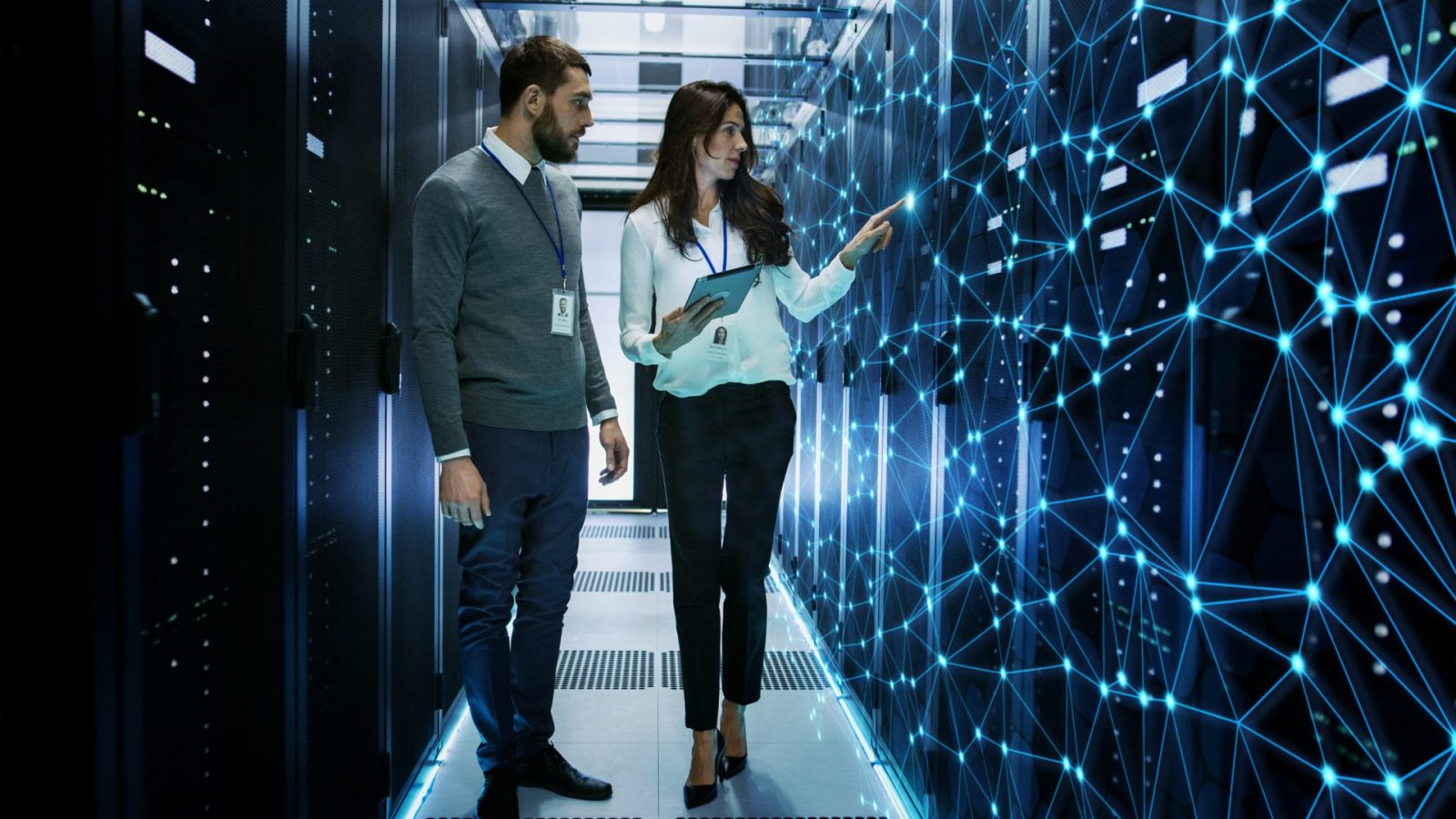 Two employees in a data server room