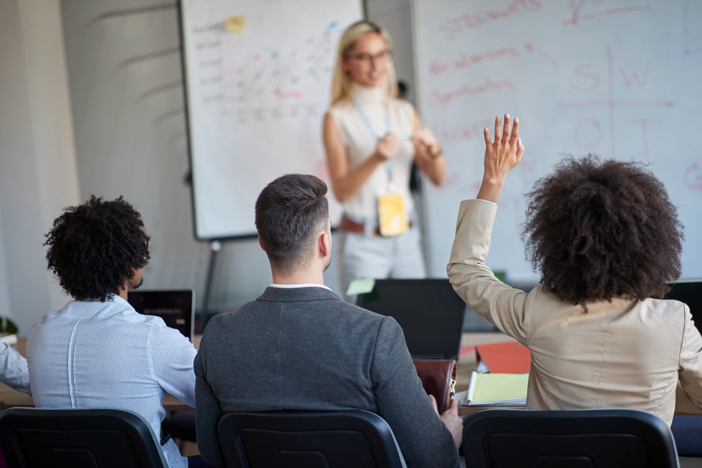 Employees raising their hands