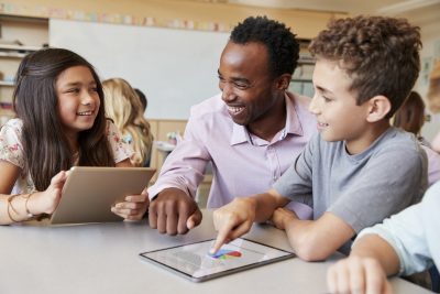 A teacher teaching her students