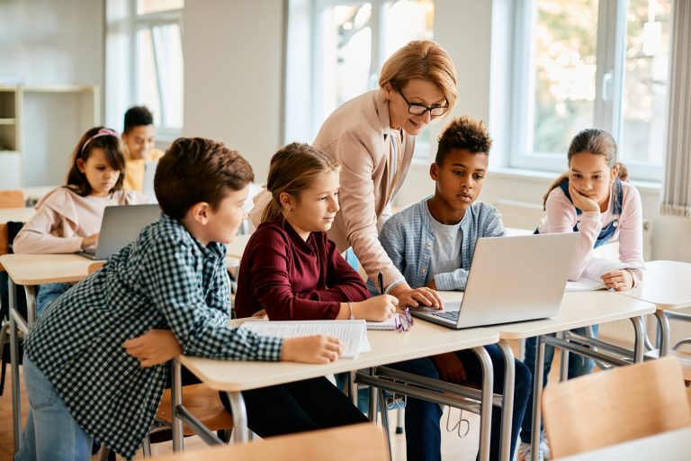 A teacher teaching her students