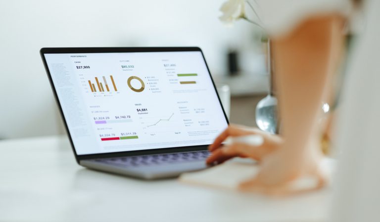 Cisco WebEx – Online Portal with Analytics – Woman Analyzing Business Report On A Laptop Computer At Work